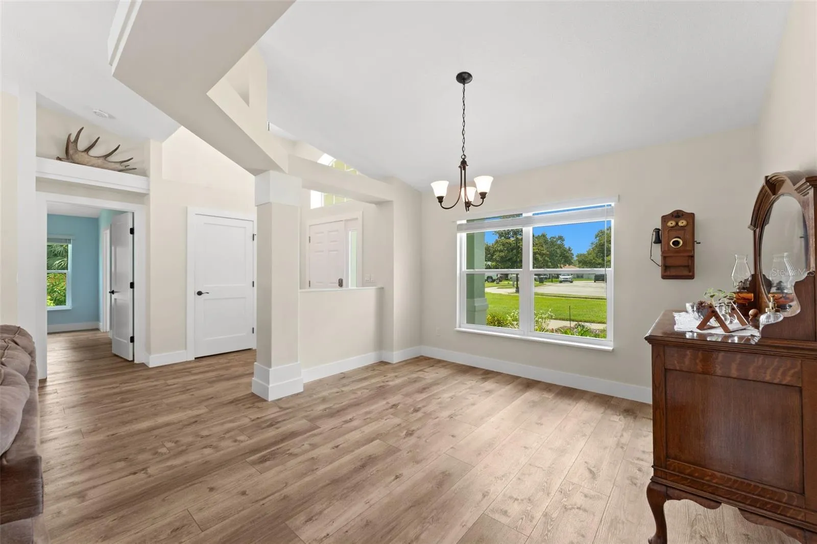 Views of dining room, foyer and entry to primary wing.