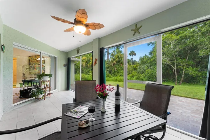 Screened lanai for dining alfresco.