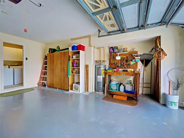 Garage showing a workbench and storage.