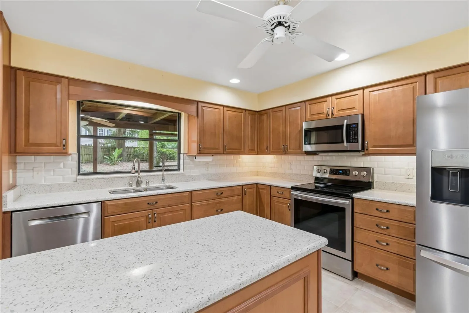 Recessed lighting makes the quartz countertops gleam