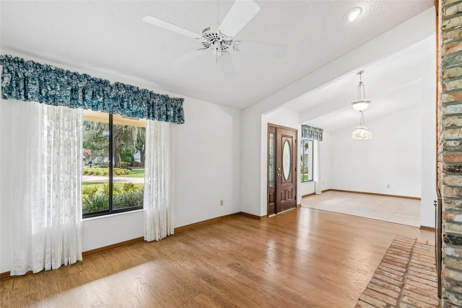 Serene wooded views of the front yard from the living room