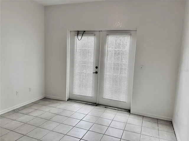 Secondary suite.  French doors open to small balcony.