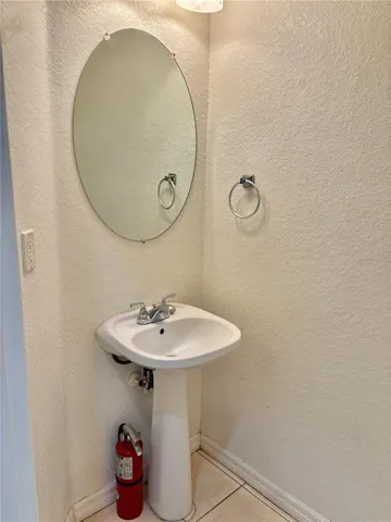 Half-bath downstairs for guests.