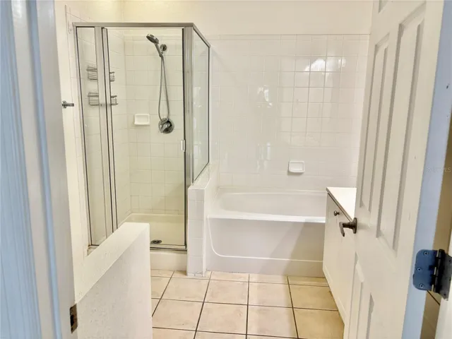 Primary en suite bath with shower and soaking tub.