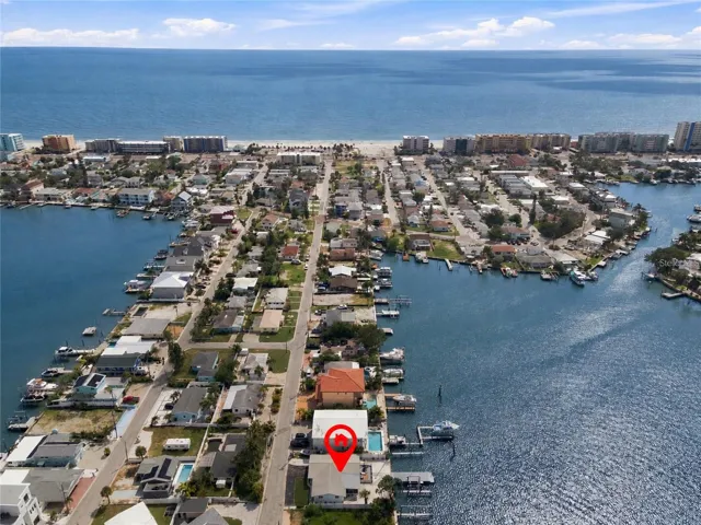 Beautiful waterfront single family home steps to the beach.