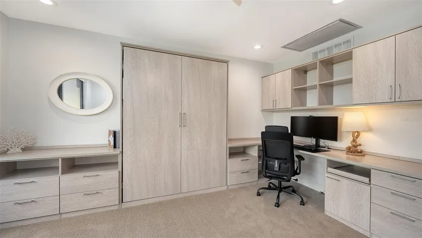 4TH BEDROOM/ OFFICE HAS GREAT SHELVING & A QUEEN MURPHY BED