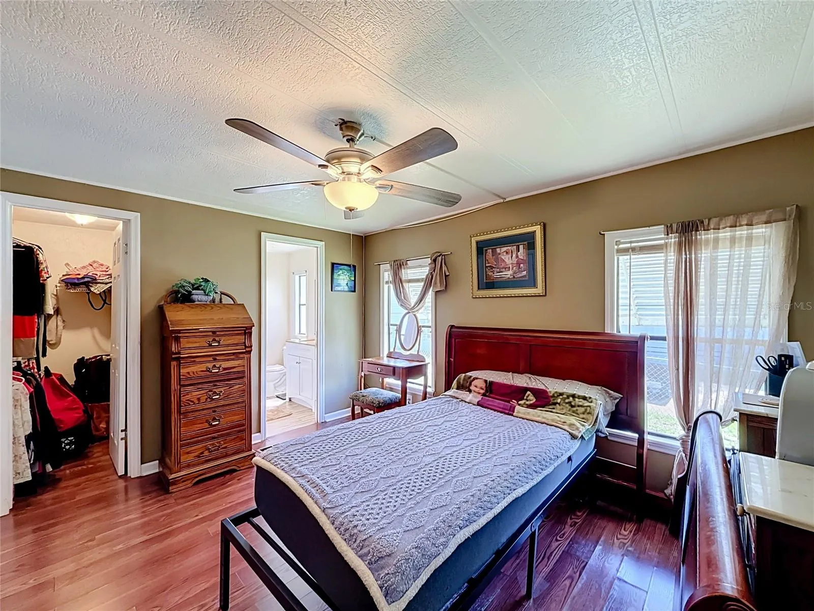Primary bedroom with closet and bath