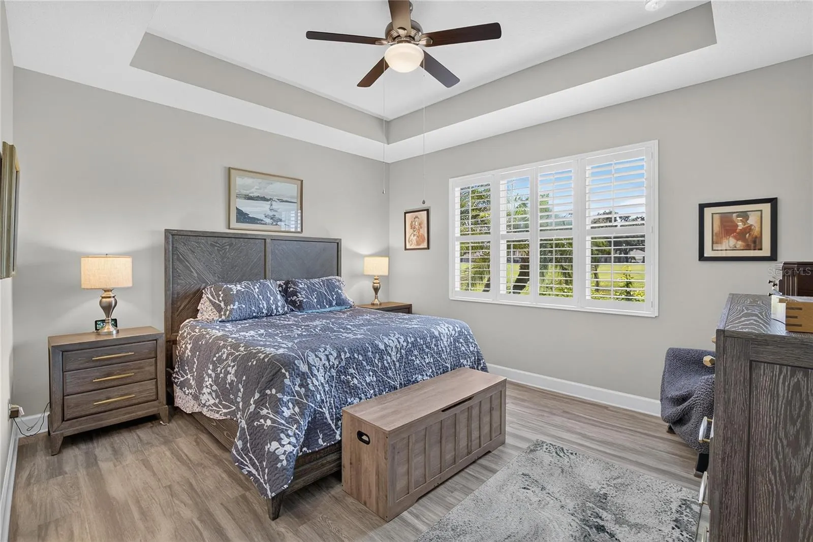 Primary bedroom has high ceilings
