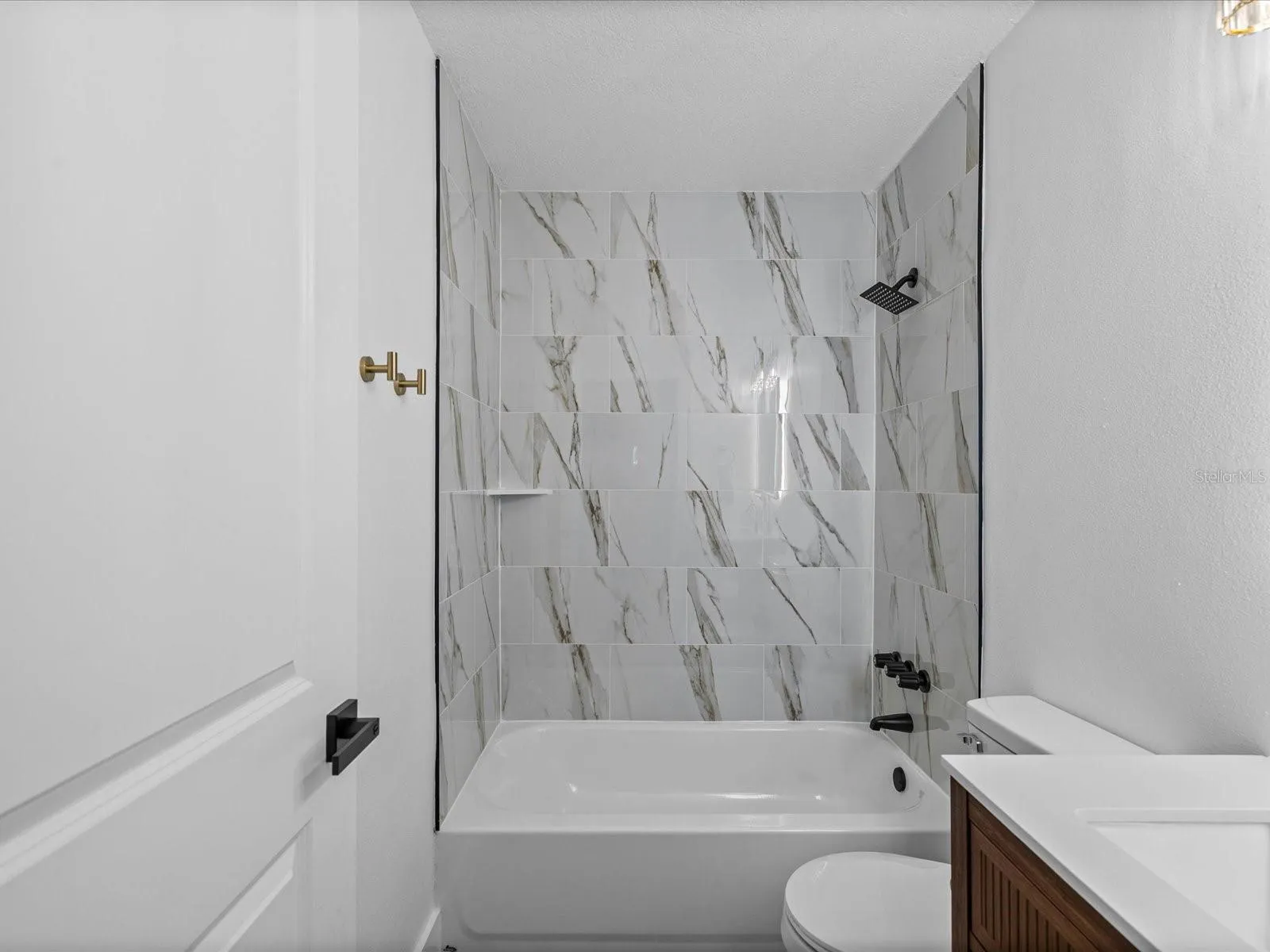 Bathroom 2 - New Tile Shower w/ tub, new toilet, new vanity, lighting and mirror