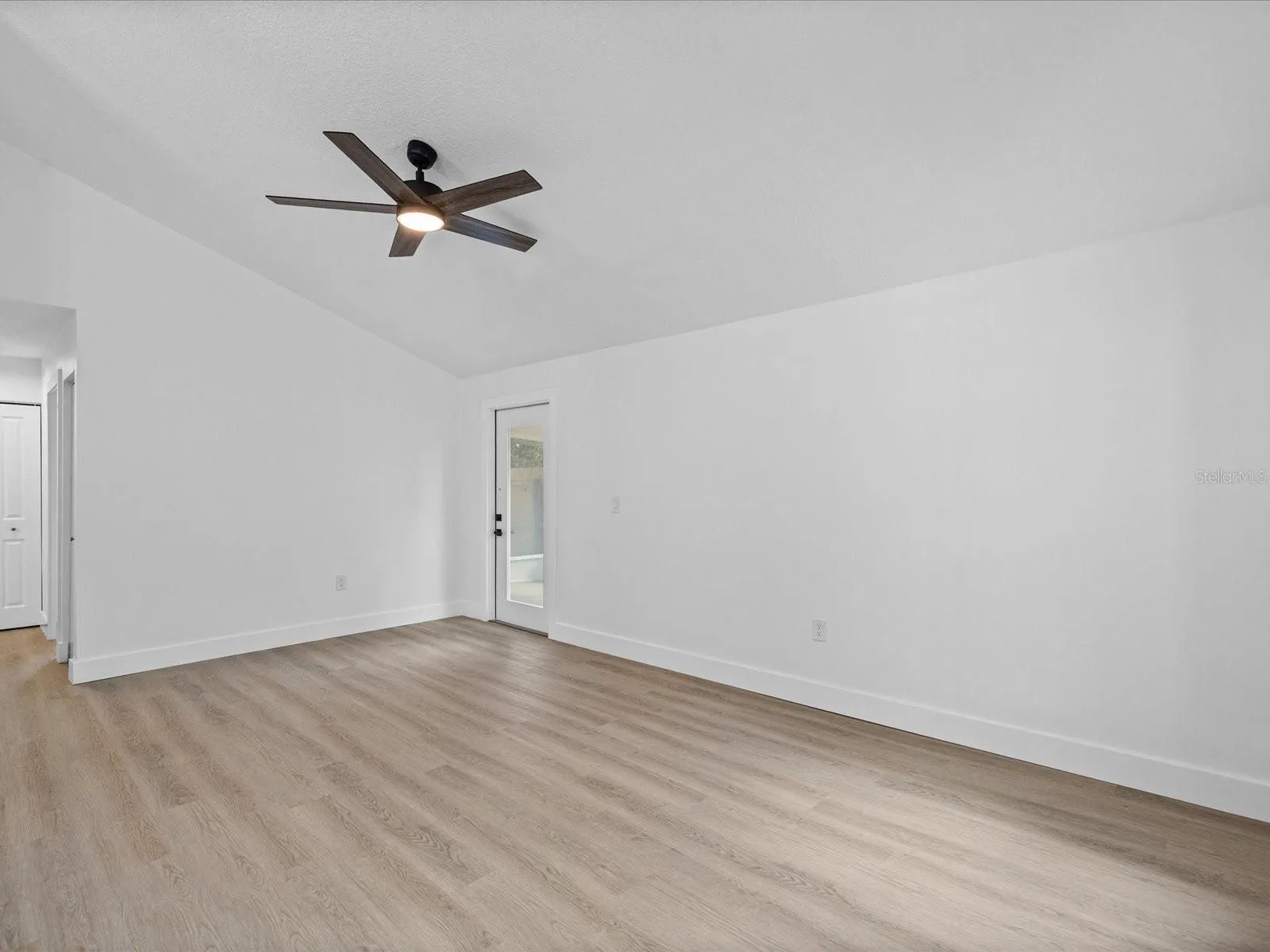 Living Room with Fan and Door to the Screened Porch