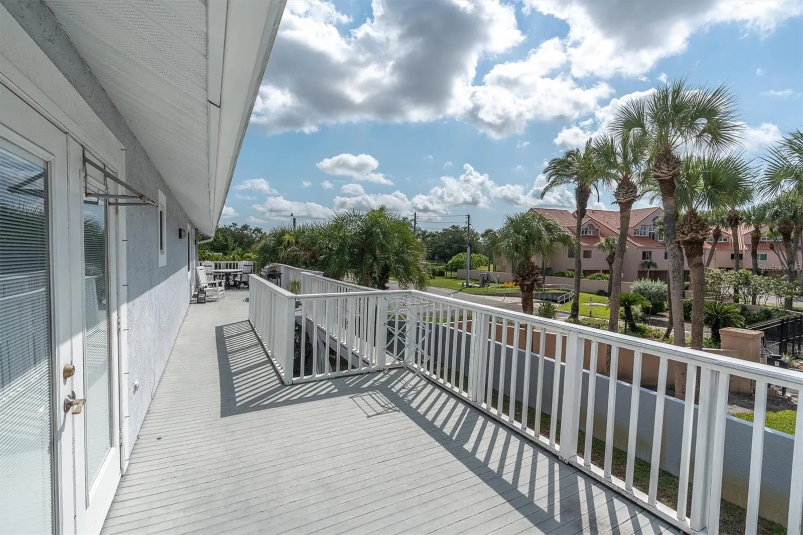 Enjoy beautiful views from the second story deck, conveniently accessible from both the primary suite &amp; the kitchen/family room areas; perfect for relaxing or entertaining outdoors.