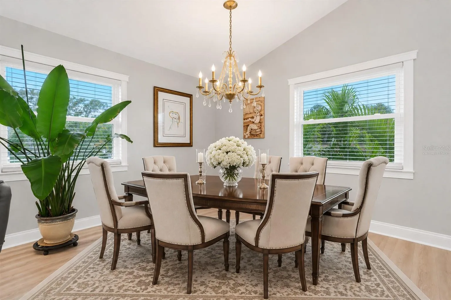 Virtually staged to illustrate how this spacious, versatile area can easily accommodate a beautiful formal dining setting.
