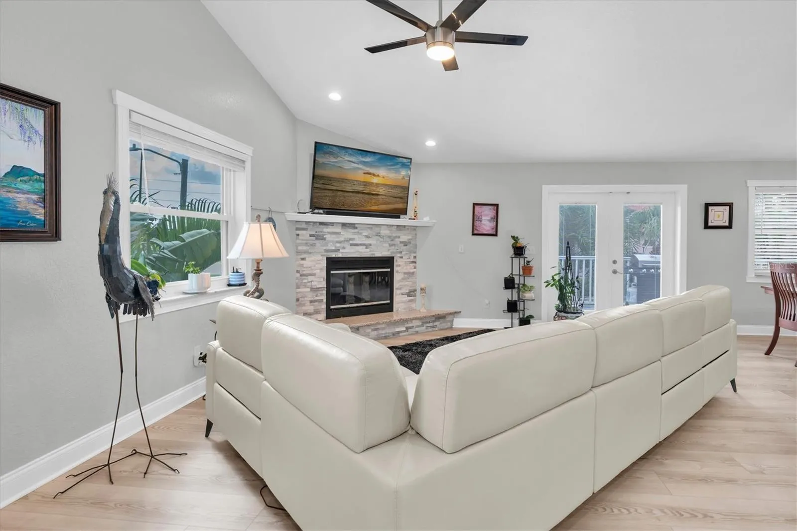 Expansive family room with generous proportions, easily accommodating a large seating arrangement while maintaining a comfortable, inviting atmosphere.
