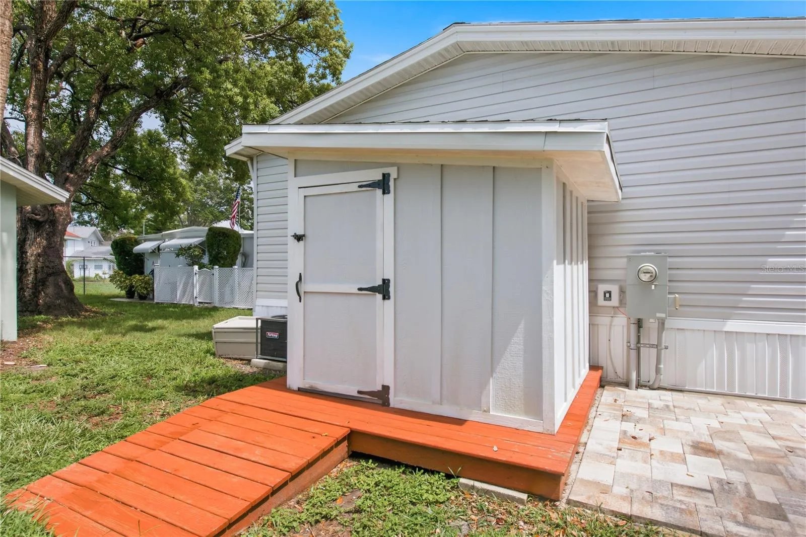 Backyard with storage shed and paver area