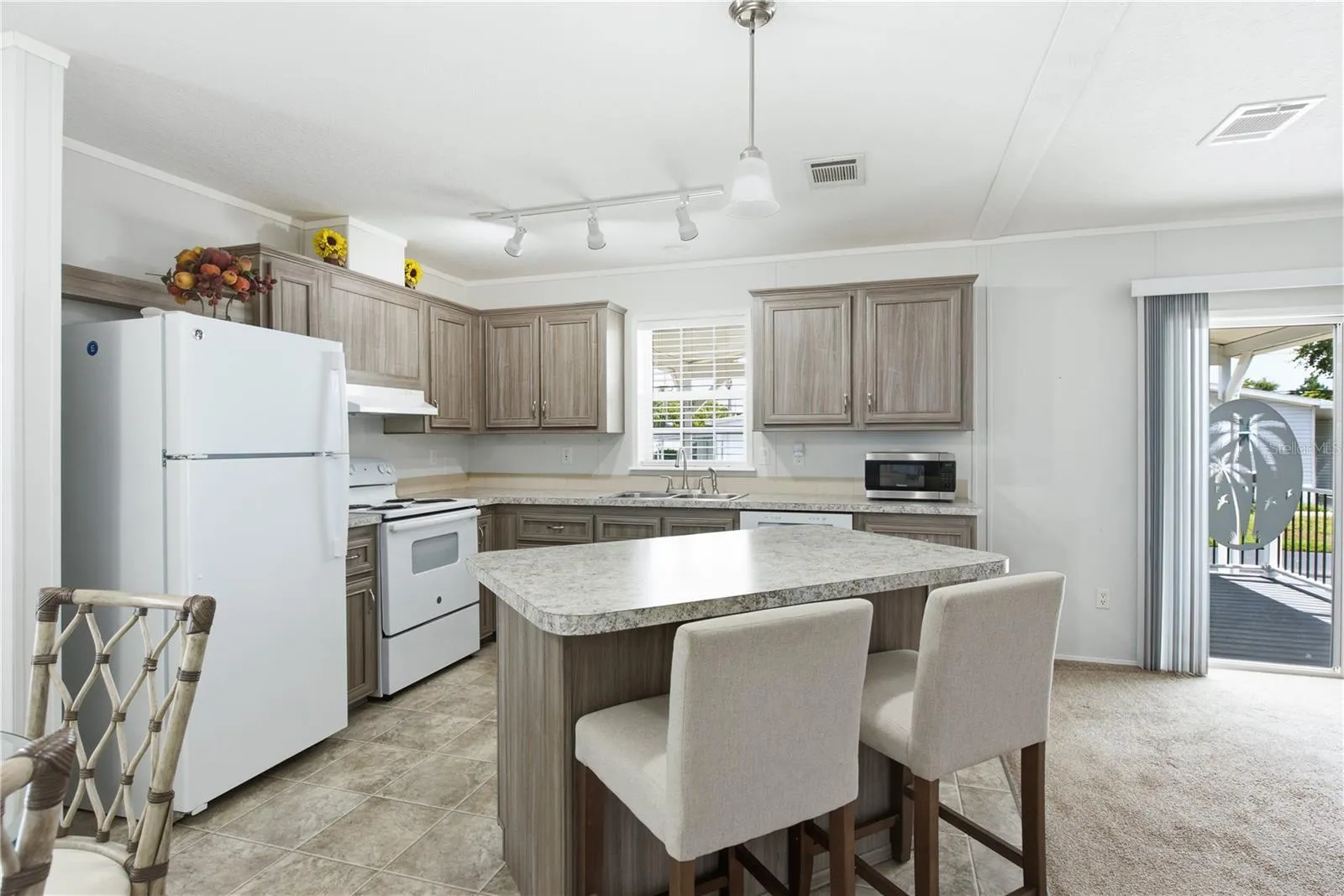 Kitchen with bar top island