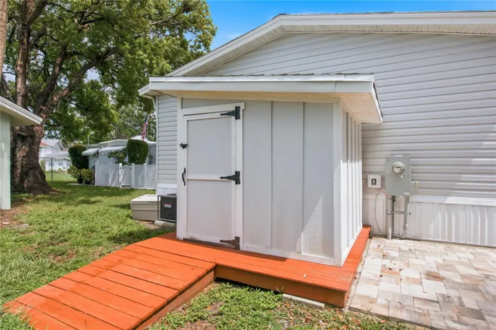 Backyard with storage shed and paver area