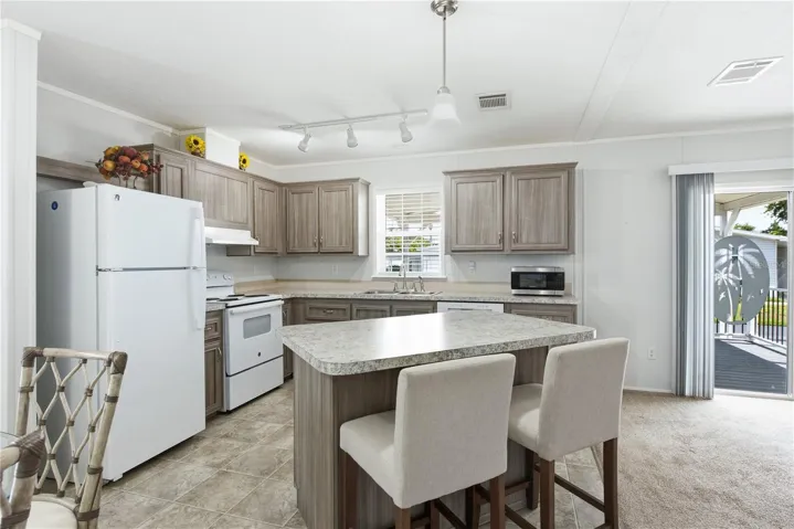 Kitchen with bar top island
