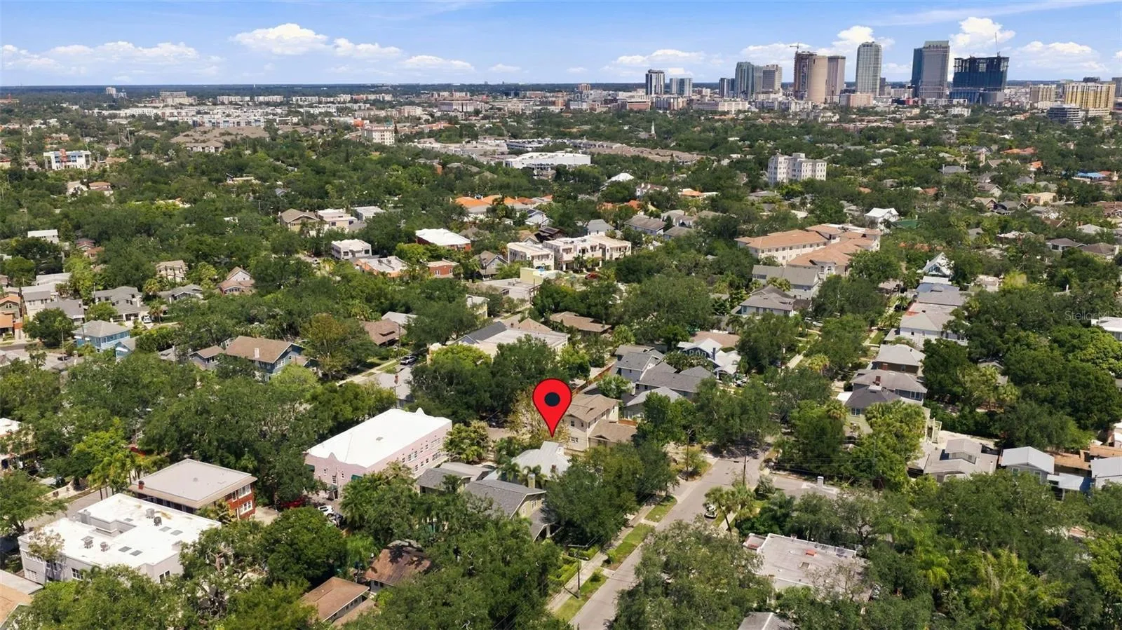 House at red marker - downtown in background