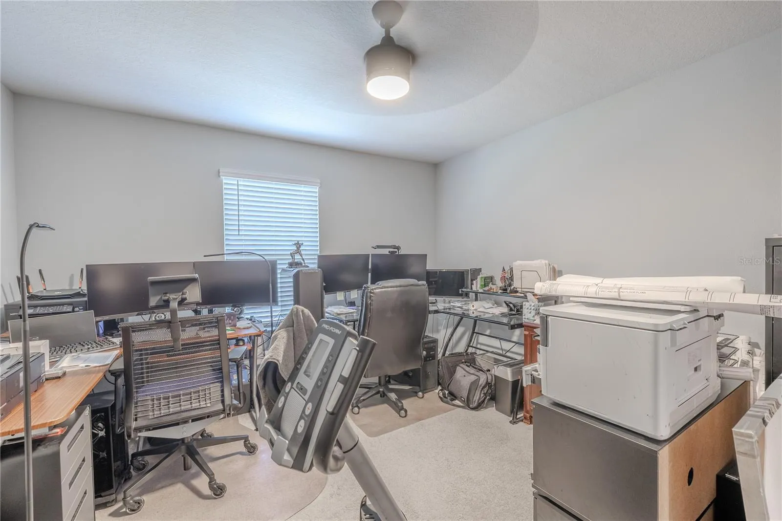 Bedroom 2 offers generous proportions, neutral carpet, a ceiling fan and natural light, with enough space for a full bedroom suite plus a desk, reading area or additional furniture.