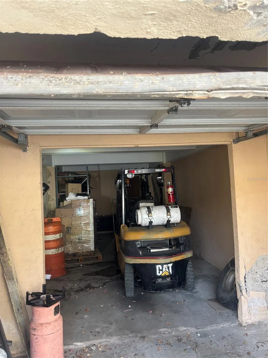 Garage has enough depth for a forklift at the rear and another vehicle.