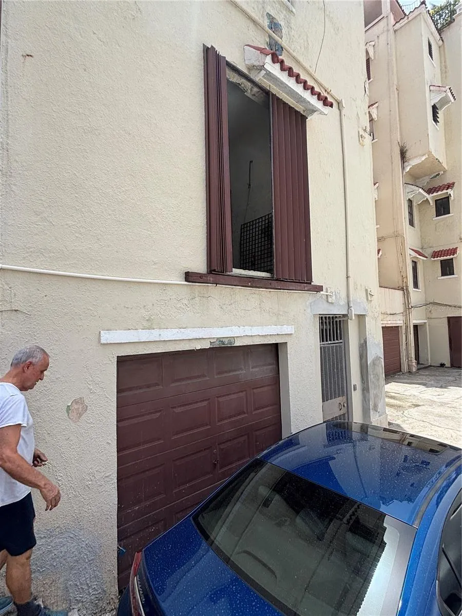 The side entrance from the warehouse leads to the garage/parking area. Warehouse loading dock is directly above the garage.