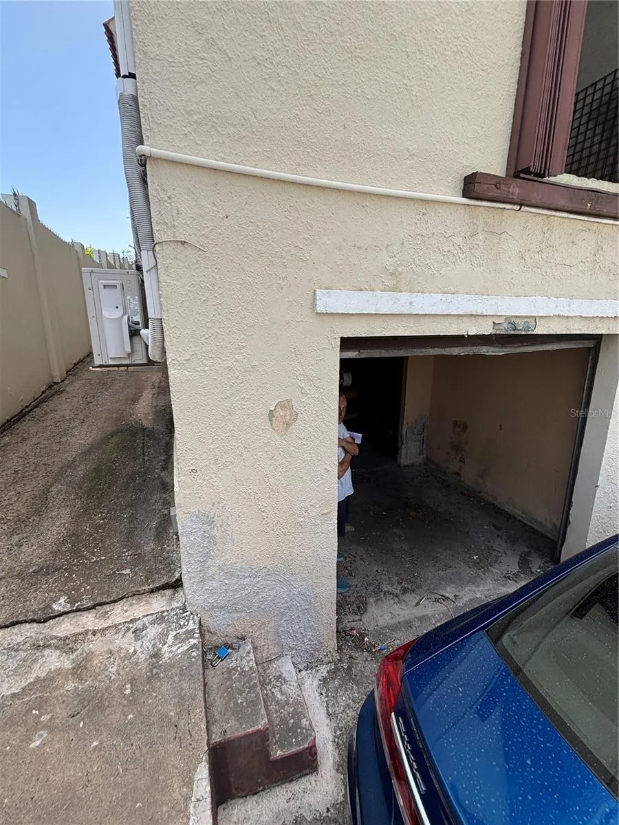 The walkway on the left of the garage leads to the warehouse level with loading dock.