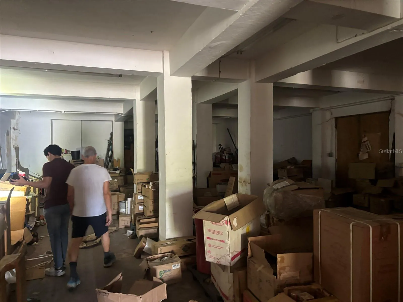 Warehouse level has doors to the lobby staircase and an exterior door the courtyard terrace and another exterior door to the lower garage level.