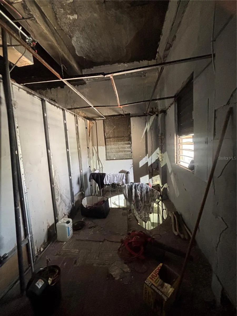 At the back of the retail level is a spiral staircase that goes to the lower warehouse level.