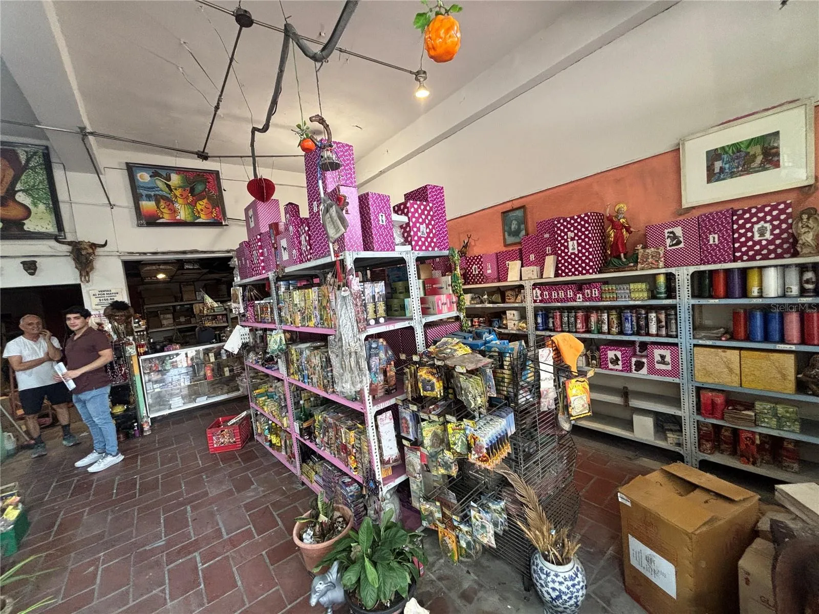 Retail space has high ceilings and goes the complete length of the building (front to back).