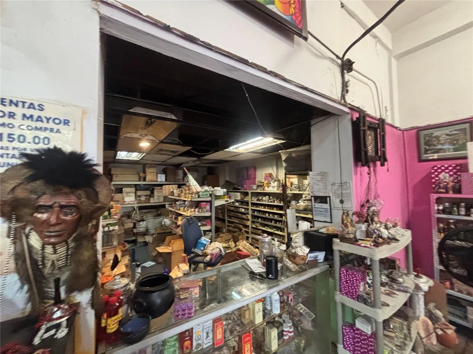 Retail counter divides store from retail inventory area.