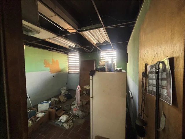 Large shuttered window are on both sides of the retail space from front to back.