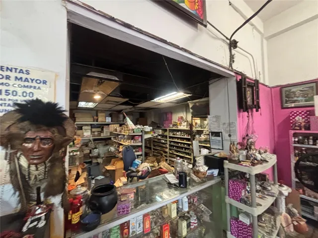 Retail counter divides store from retail inventory area.
