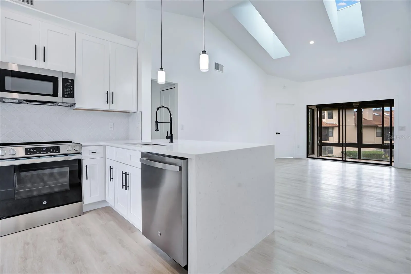 Open-concept kitchen flows seamlessly into the main living area.