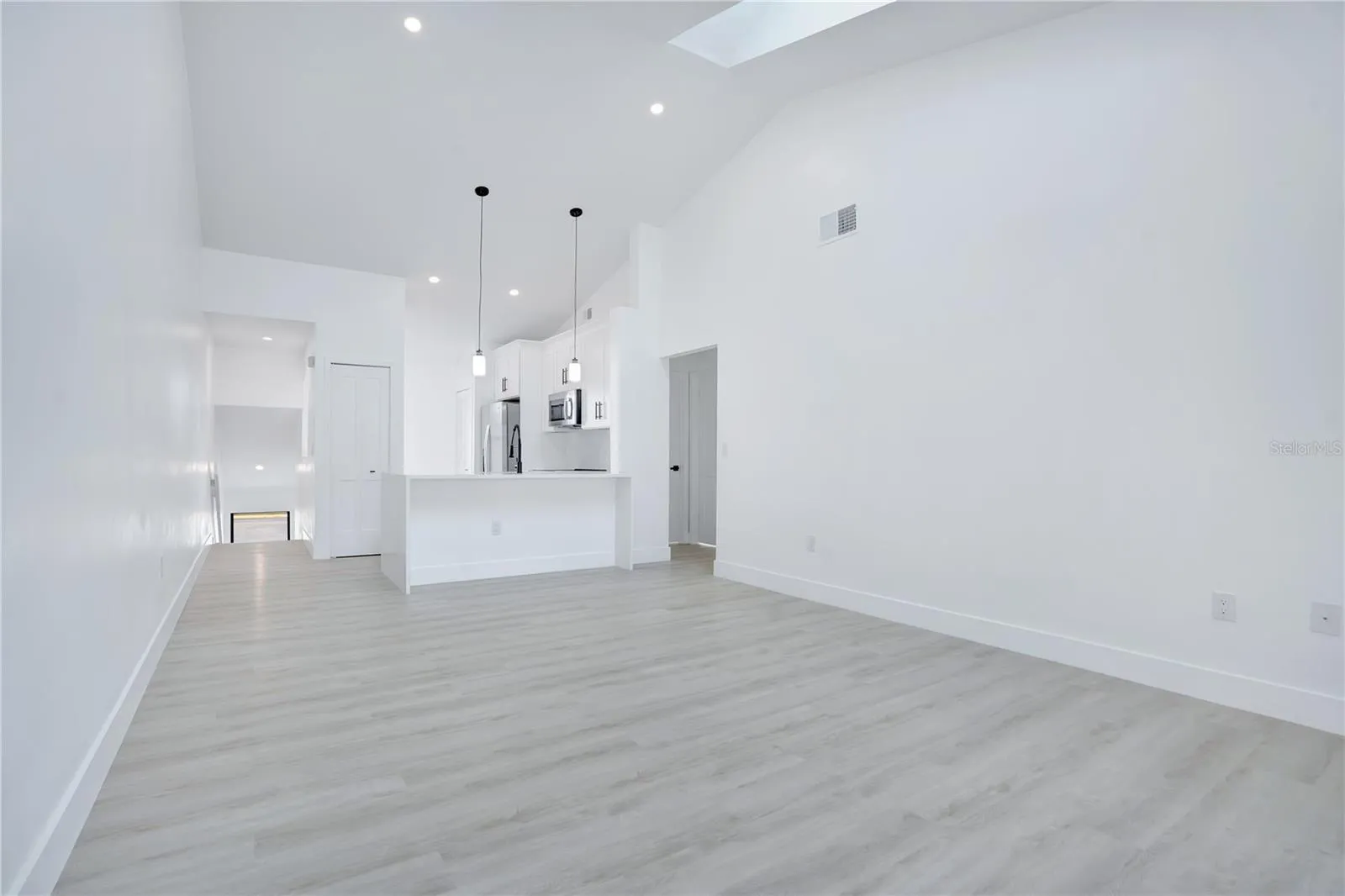 Vaulted ceilings enhance the spacious and airy feel of the main living area.