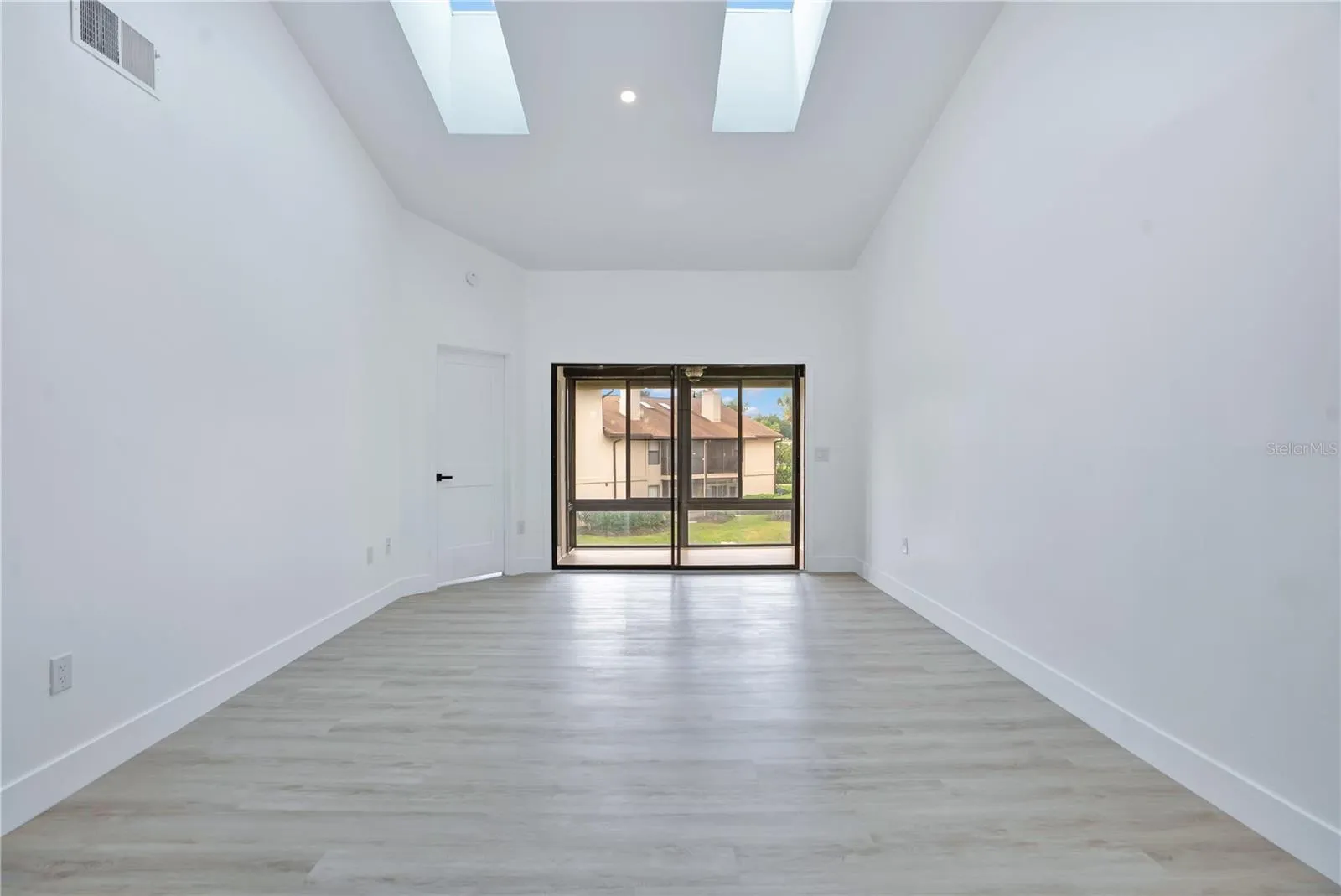 Vaulted ceilings enhance the spacious and airy feel of the main living area.