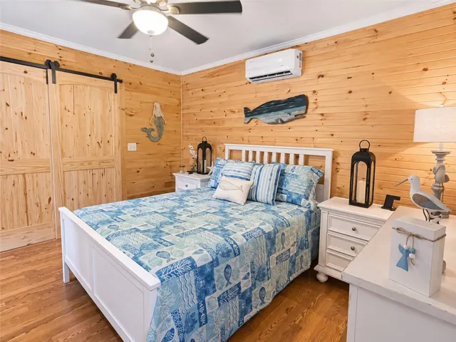 Custom with barn door and private patio beyond