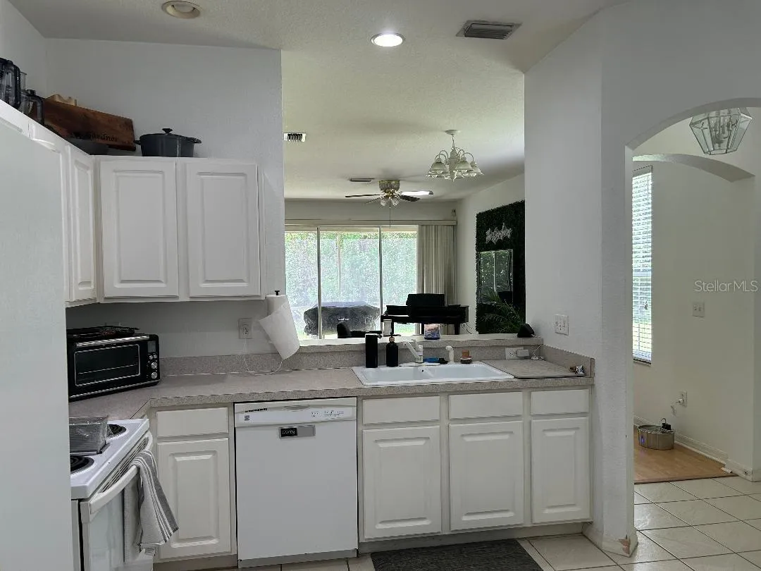 Kitchen with brekfast bar opens to LR?DR to lanai