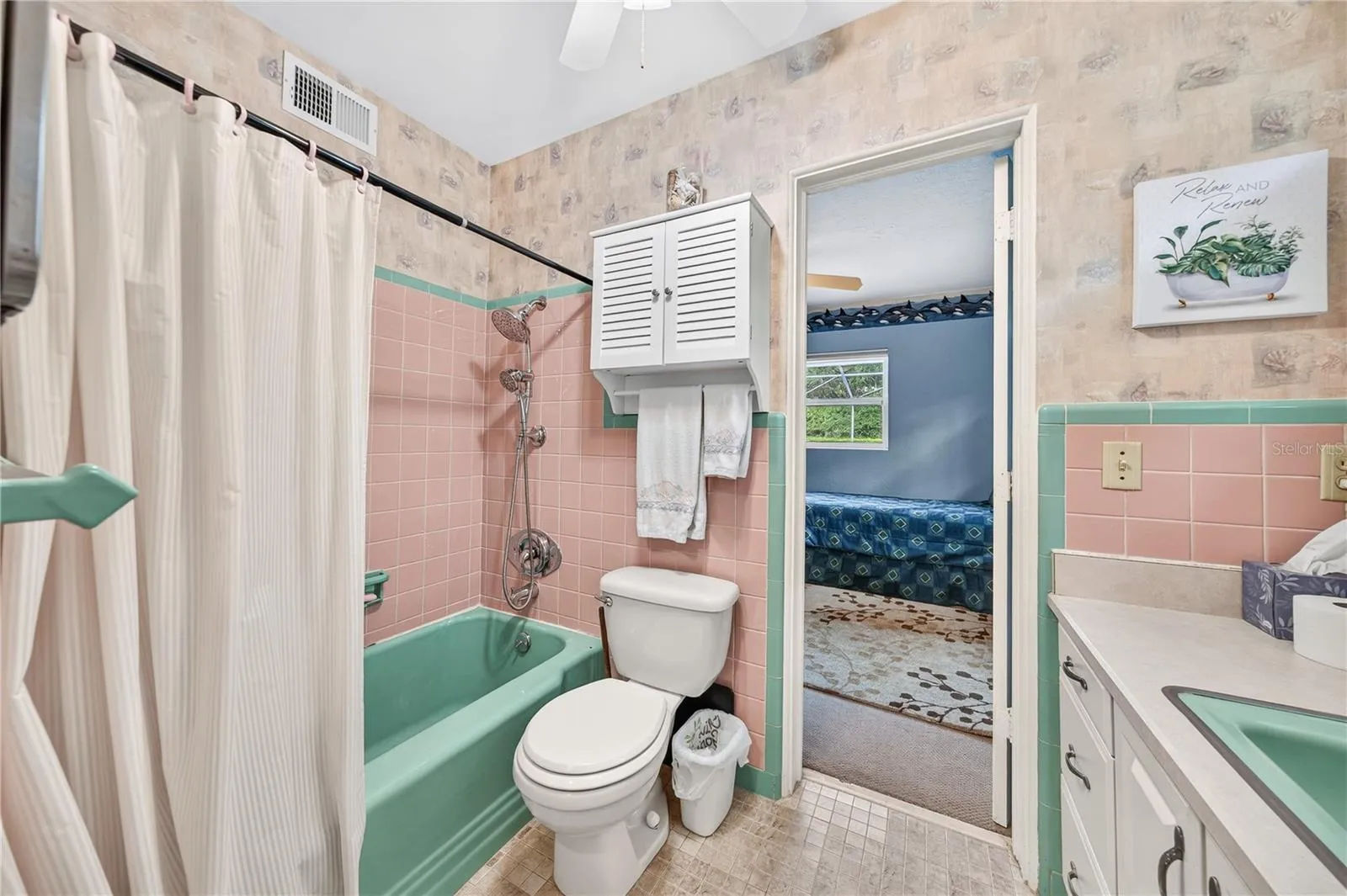 Full bath shared with Primary and bedroom #2.