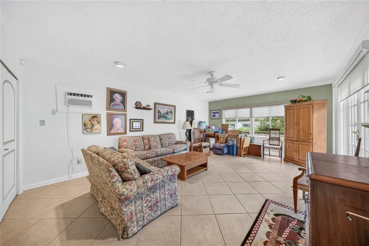 Family room with a pool view.