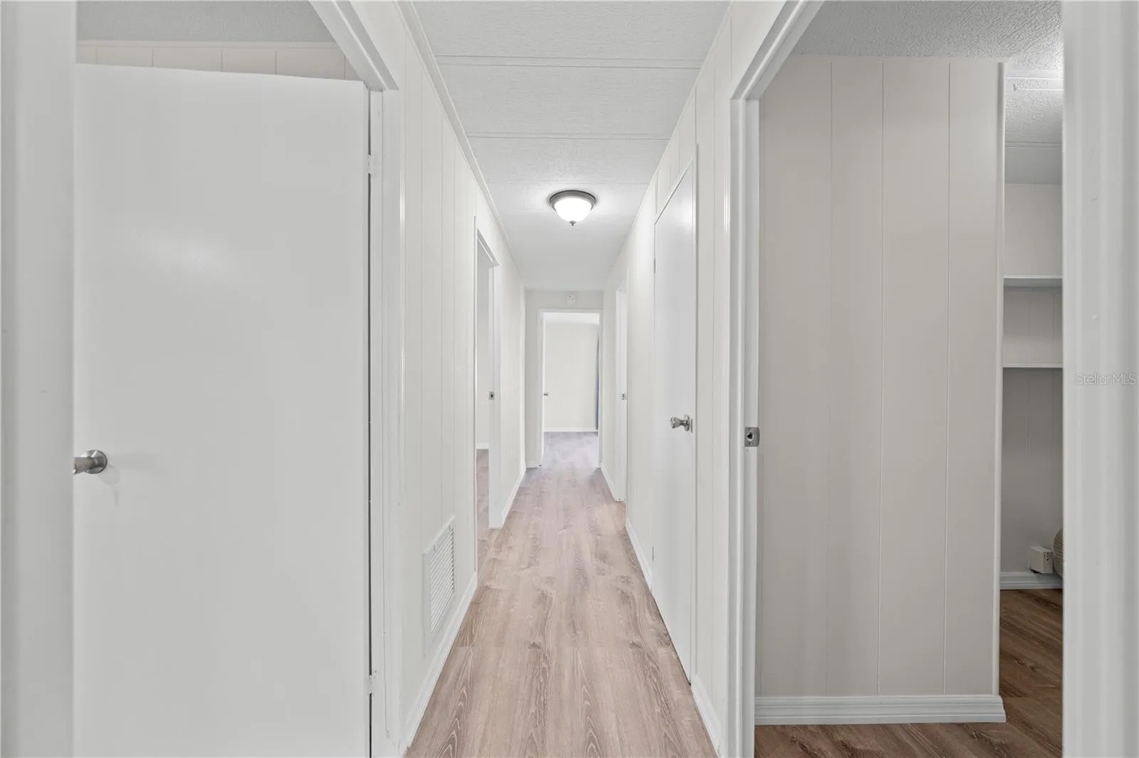 Hallway leading to 3 bedrooms, 2 bathrooms and indoor laundry