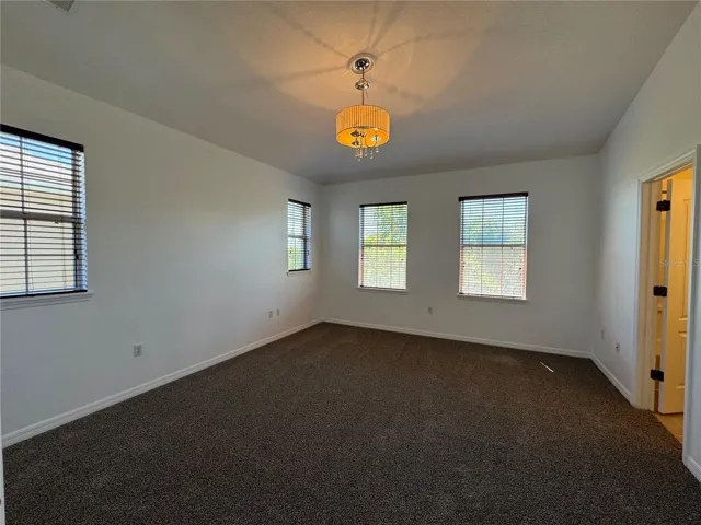 Spacious primary bedroom with large walk-in closet &amp; ensuite bathroom.