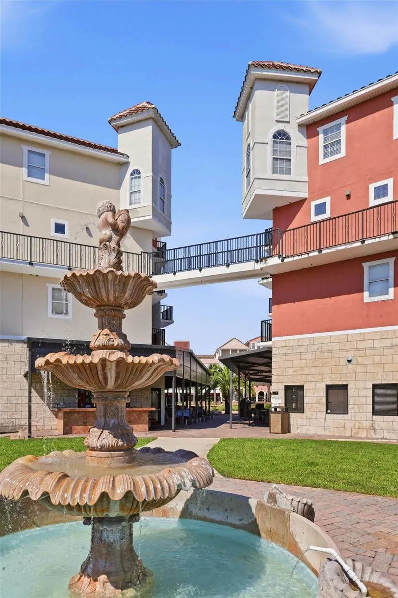 The Breakfast Nook of 418B occupies the distinctive top-floor corner tower shown on the right, overlooking the European Village courtyard.