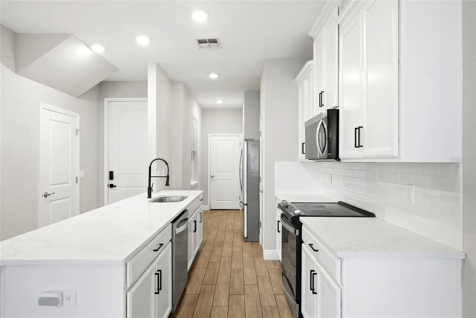 Kitchen area with access to the garage