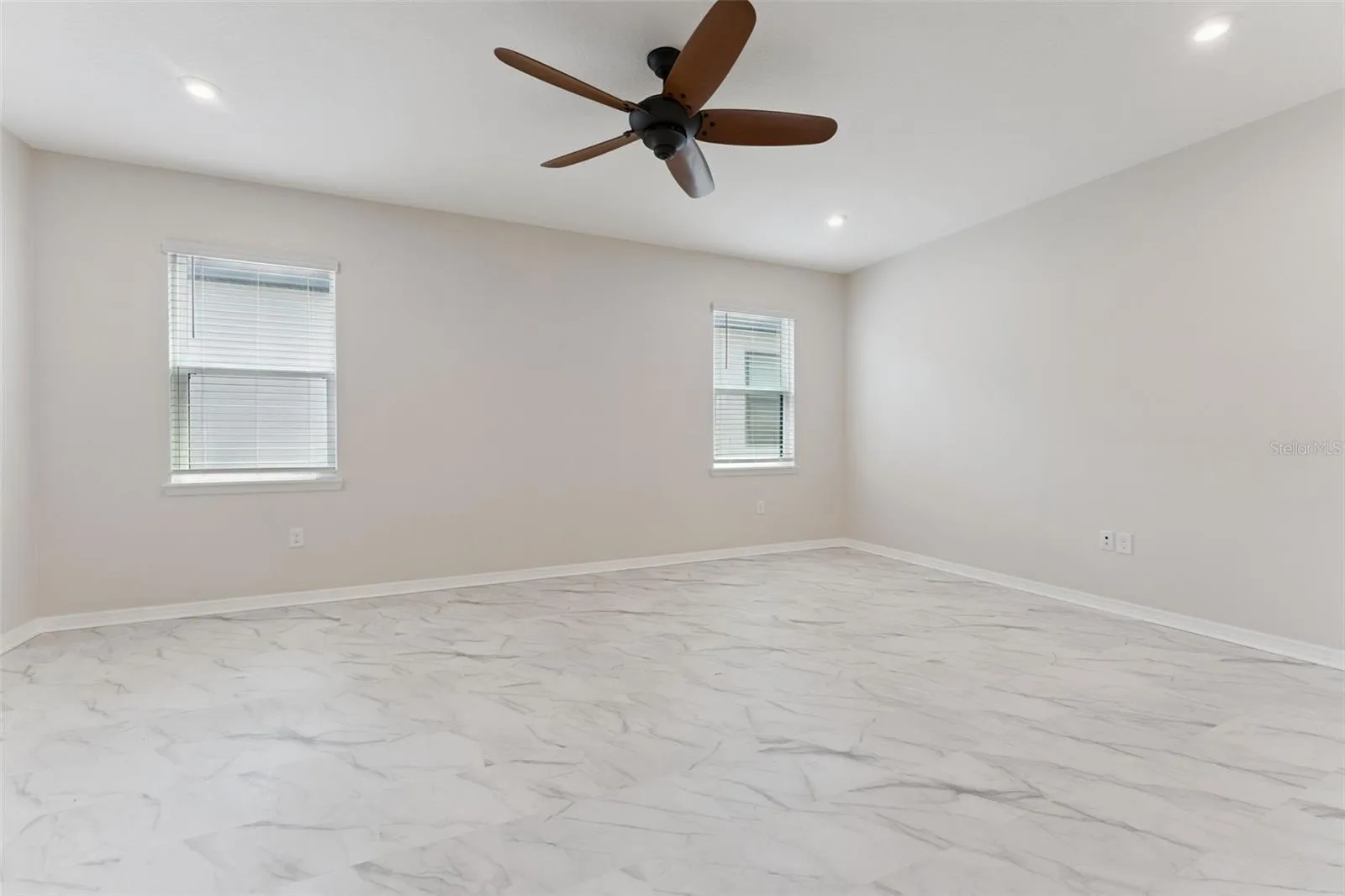 Bonus Room – A second angle highlights the generous open floor area and multiple windows that bring natural light into this versatile upstairs retreat.