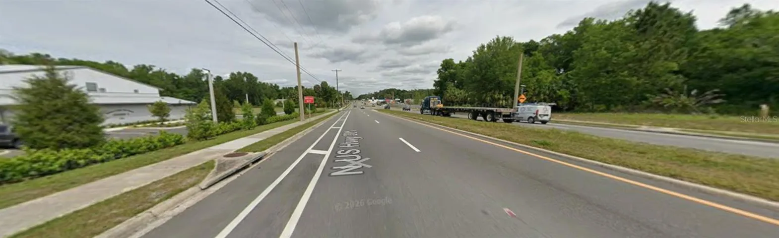 Heavy truck traffic on this main route.  Across from New Fire Department