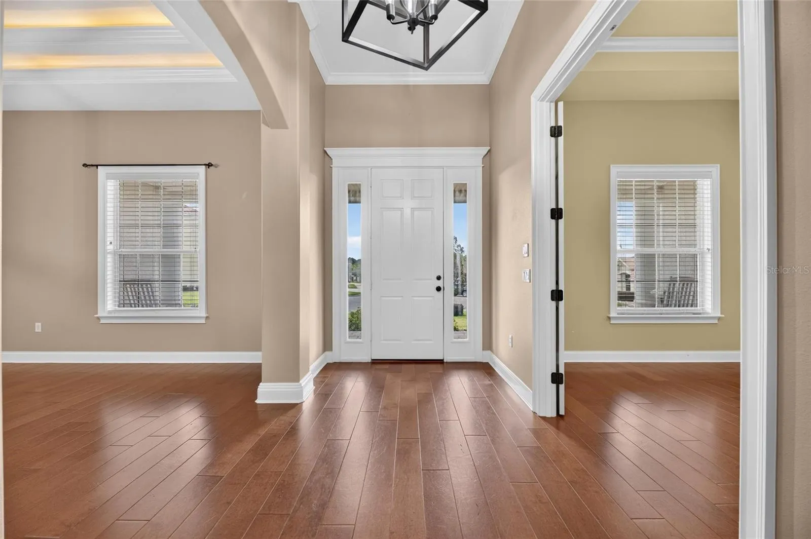 Beautiful Front Entry Way with beautiful wood flooring welcome you in this custom built home