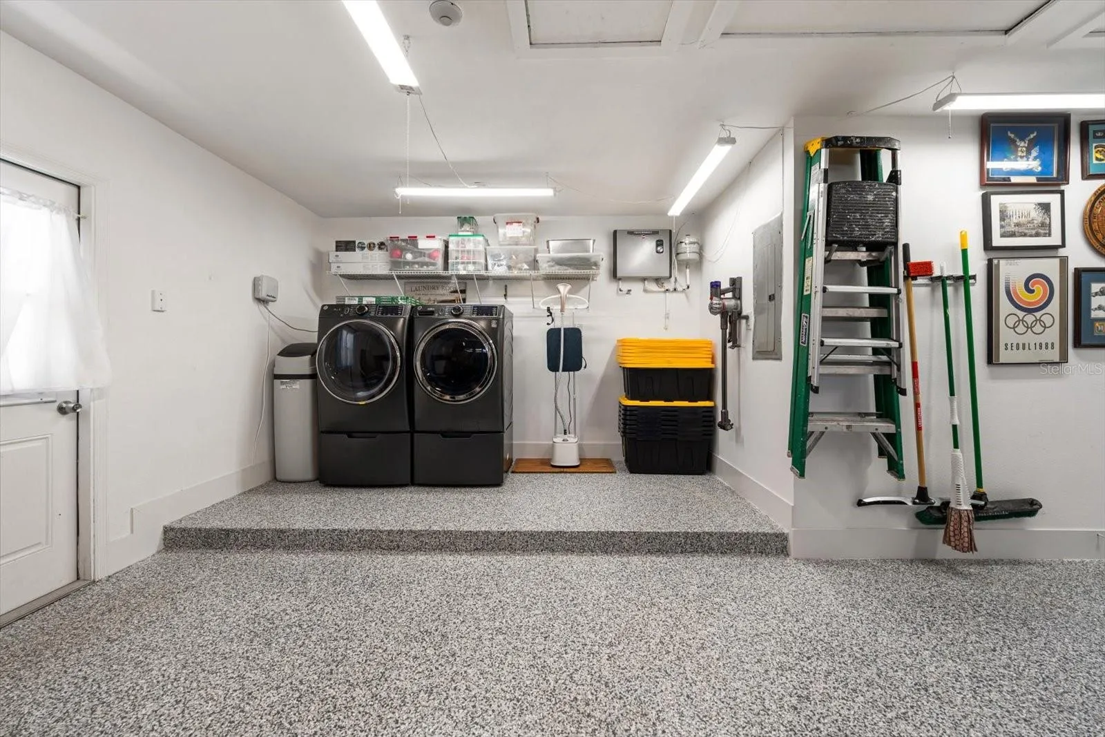 Plenty of space around the laundry with new washer/dryer and on demand water heater means you never run out of hot water!