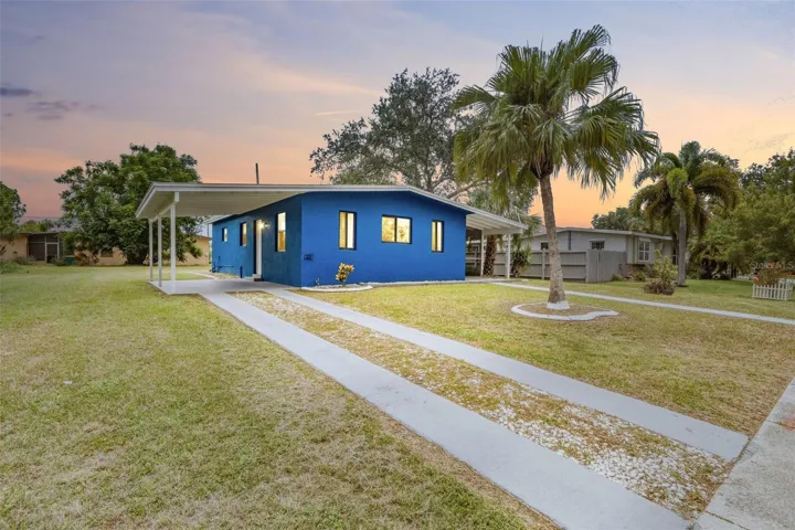 Charming Cottage Style Home with Mature Palms & Extra Long Carport
