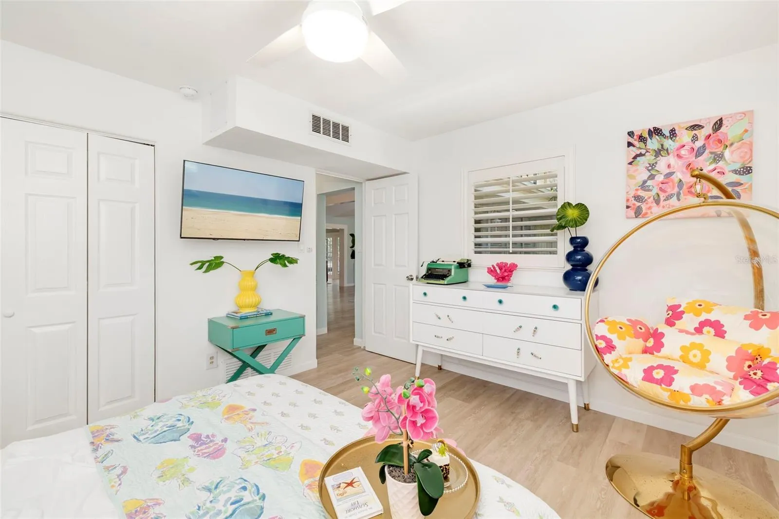 This bedroom is just off the living room with great windows. and plantation shutters