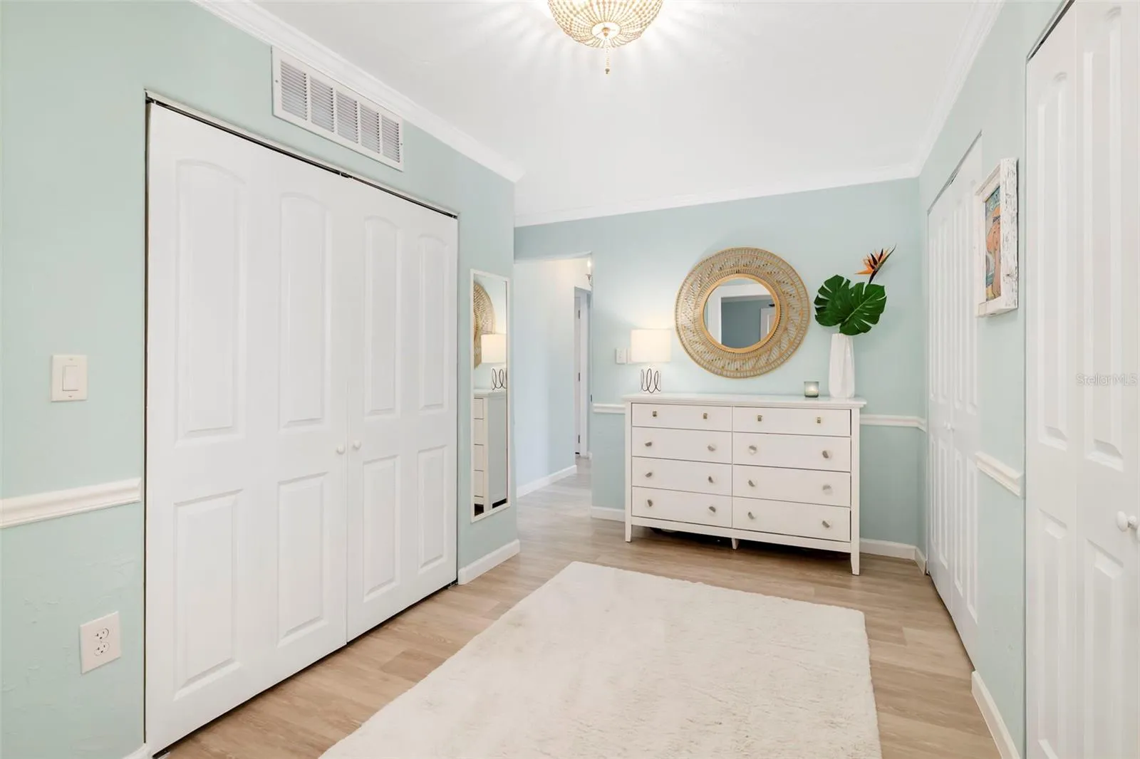 Primary dressing room has 3 built-in closets